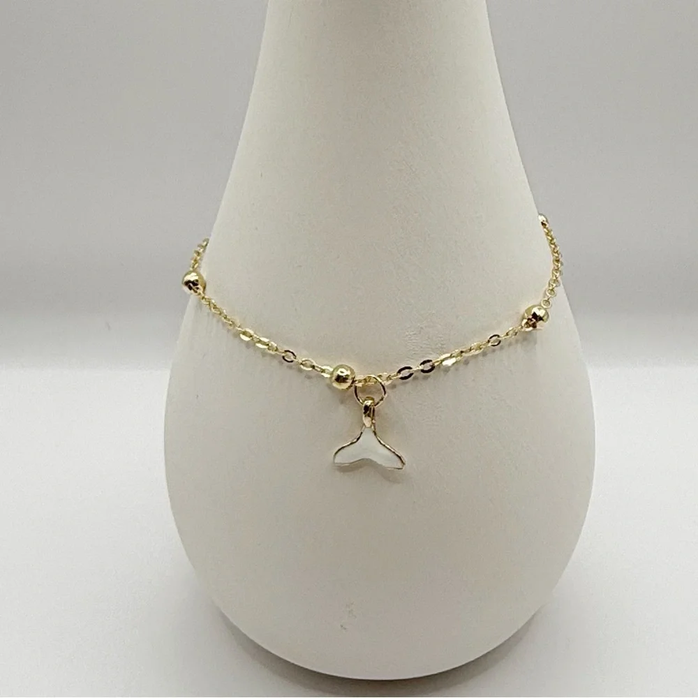Gold Beaded Bracelet With Whale Tail Charm